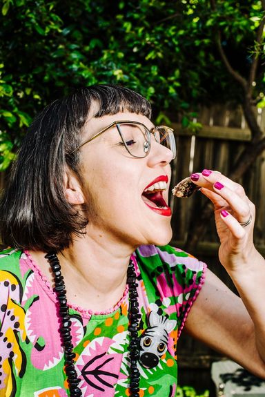 Lana eating a delicious oster topped with Yes Yum oyster dressing