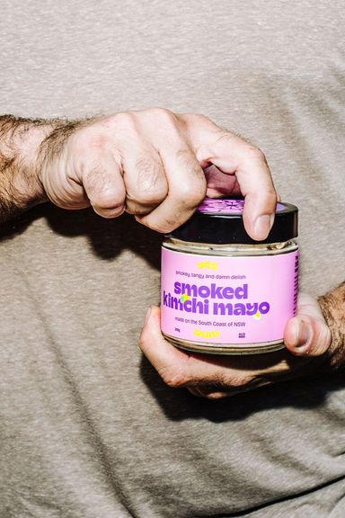 James holding a jar of Smoked Kimchi Mayo