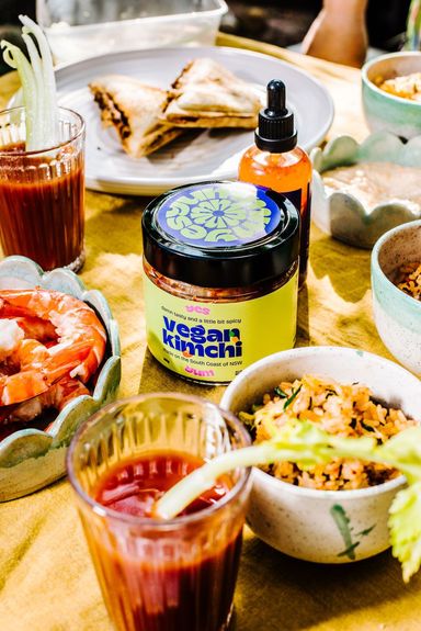 A jat ofYes Yum Vegan kimchi sits on the table 